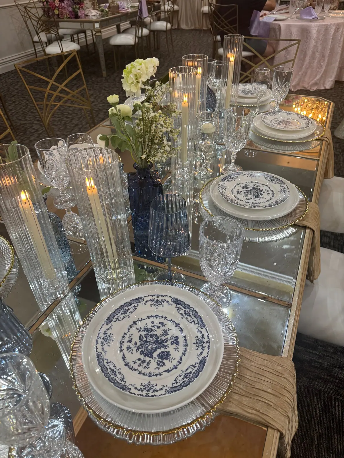 Blue-and-white china and crystal glasses at a place setting